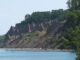 The 597-acre, minimally developed Chimney Bluffs State Park lies along Lake Ontario’s shoreline and features numerous tall pillars of rock for which it was named.